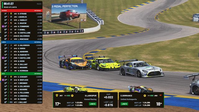On air at Road Atlanta: three GT3 cars side by side on the TV camera, with the 1v1 battle card for the two in focus.